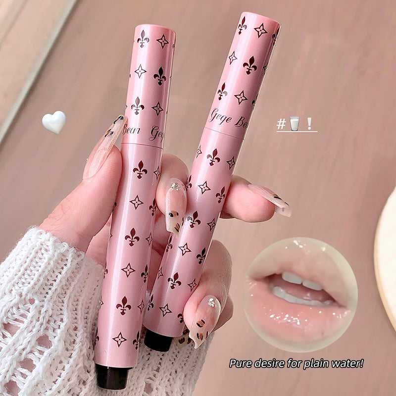 Two pink lip glosses with decorative patterns held by a hand, with a close-up of lips wearing the product.