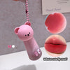 Pink lip mud product with bear design and keychain, inset images of lips.