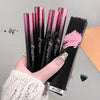 Hand holding Gege Bear lip gloss with packaging on a neutral background