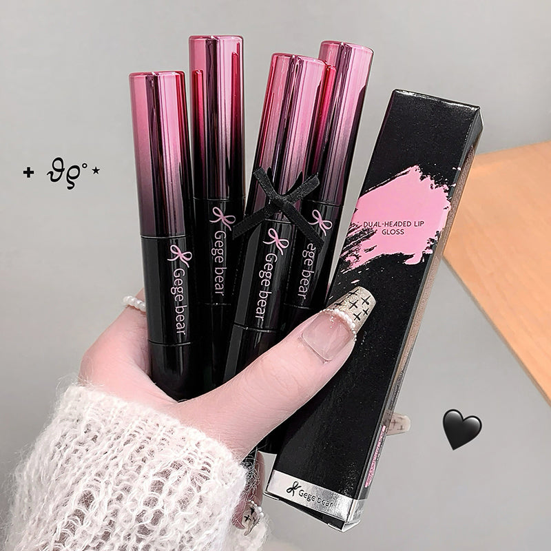 Hand holding Gege Bear lip gloss with packaging on a neutral background