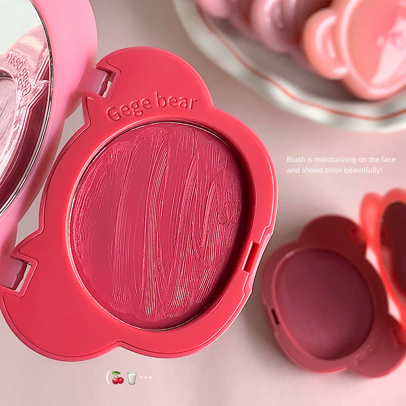 Pink blush compact with 'Geege bear' branding on a light pink background