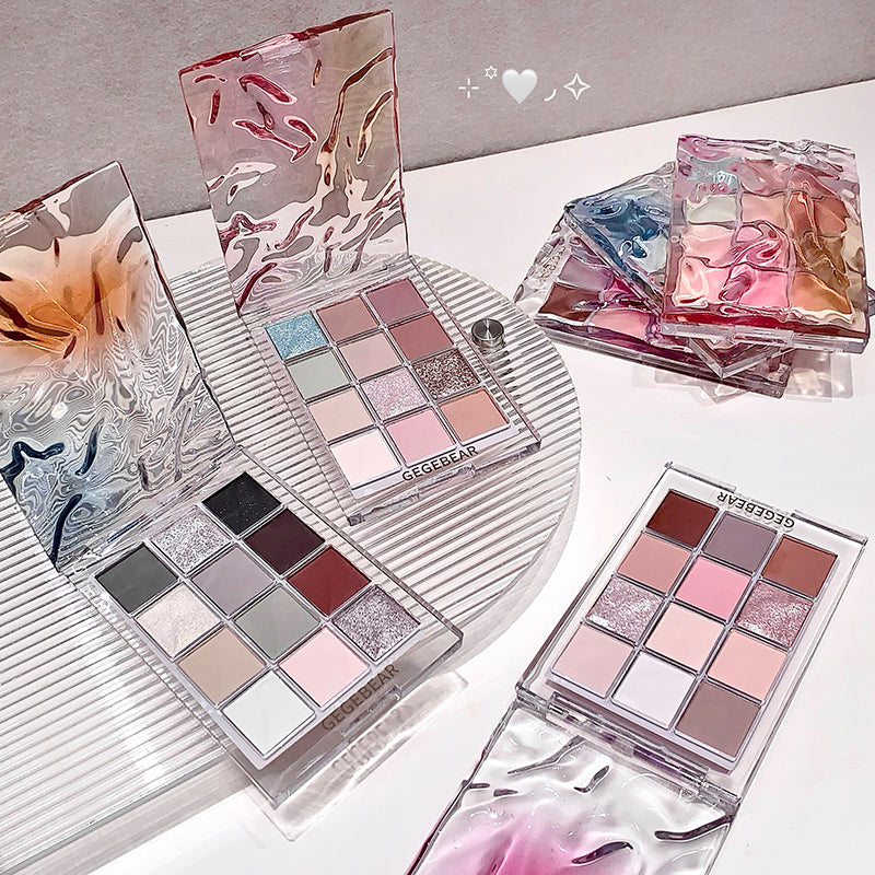Makeup palettes with colorful shades on a white surface