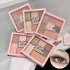 Set of four eye shadow palettes with pink cases on a light gray background, one palette open showing shades.