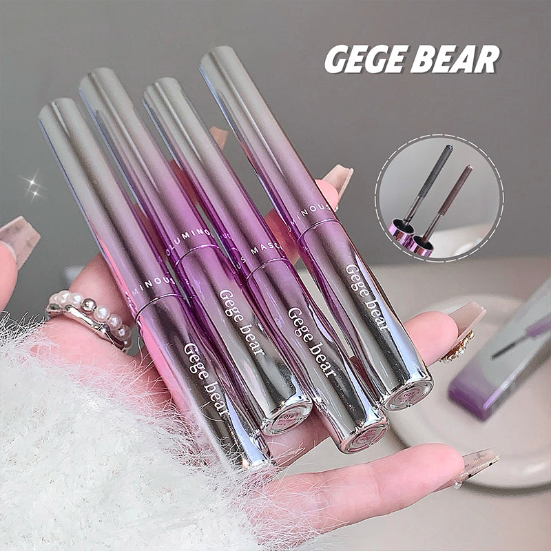 Set of GEGE BEAR lip glosses held in a hand with a blurred background