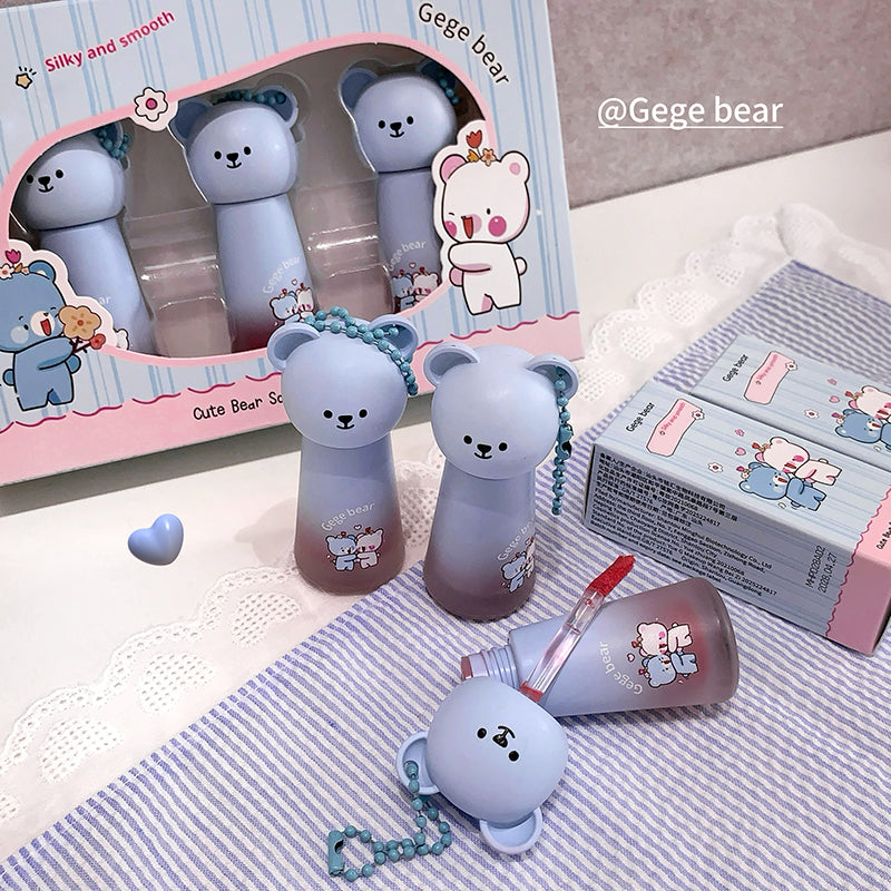 Cute bear-themed products with packaging on a textured surface