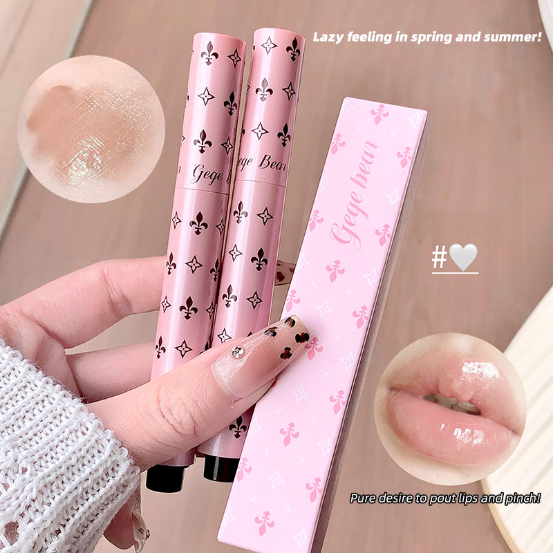 Pink lip gloss with decorative packaging held by a hand, with close-up shots of the product and text on a beige background.