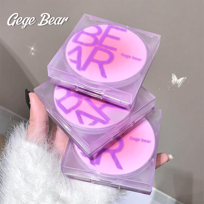 Stack of Gege Bear branded makeup products held by a hand against a neutral background