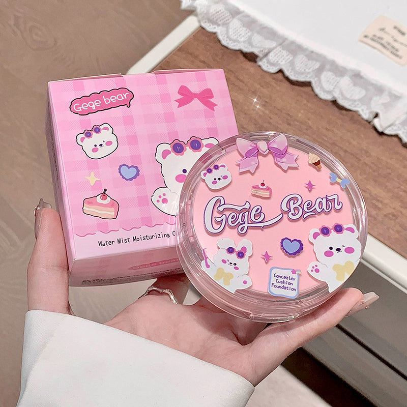 Pink 'Gege Bear' cosmetic product and packaging held in a hand.