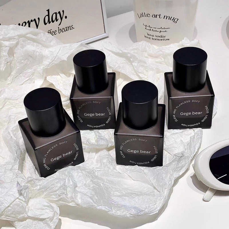 Black cylindrical containers with 'Gege bear' branding on a white textured surface.