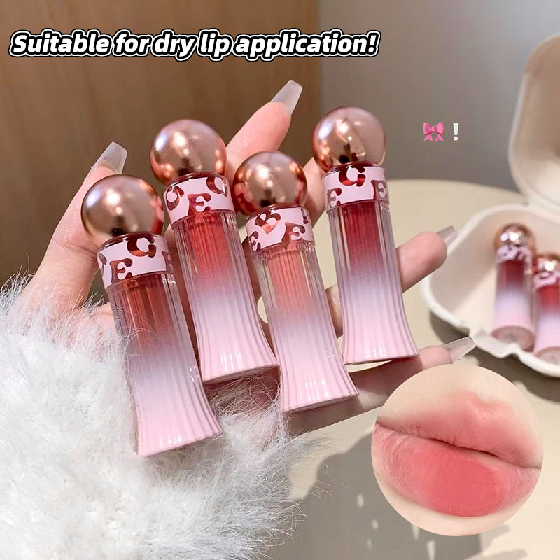 Set of pink lip balms with gold caps held by a hand, suitable for dry lips.