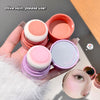 Three makeup sponges in different colors held by a hand, with a blurred background.