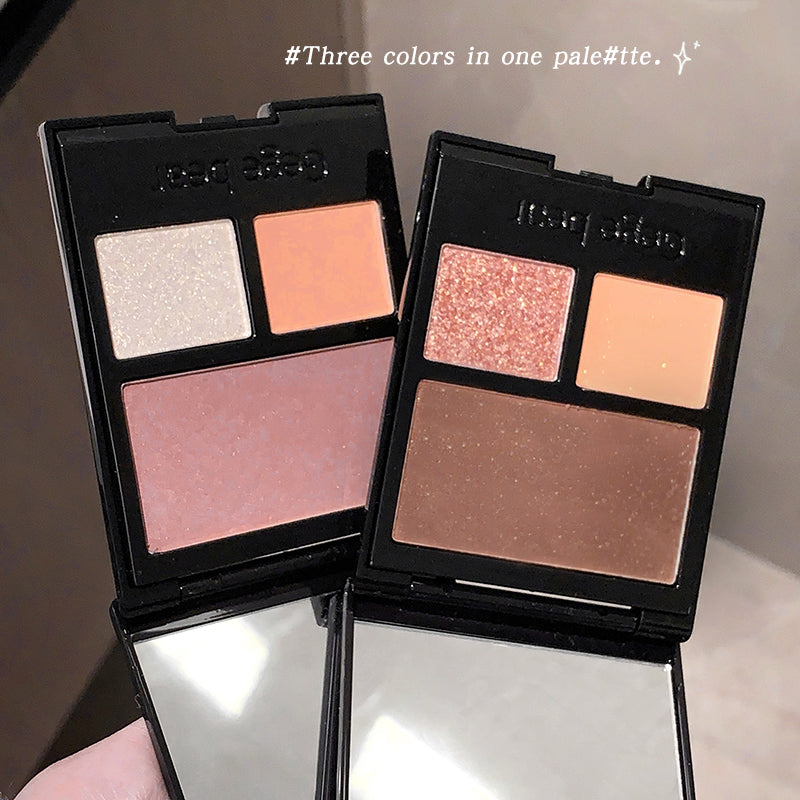 Two makeup palettes with different color combinations on a reflective surface.