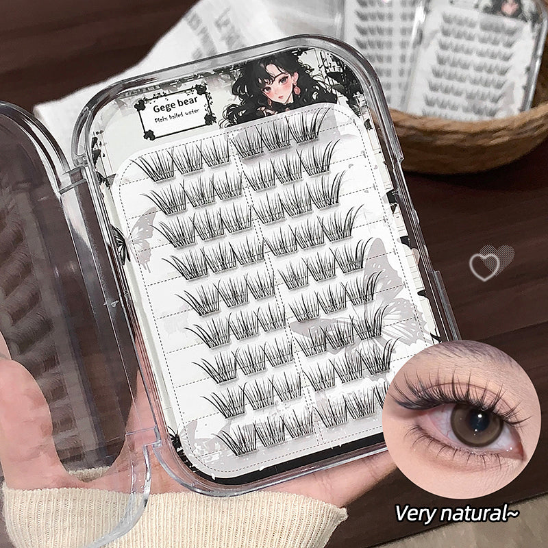 Set of false eyelashes in a case with an inset showing the effect on an eye.