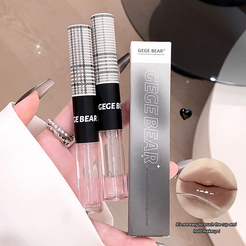 Two GEGE BEAR lip glosses with their packaging held by a hand.