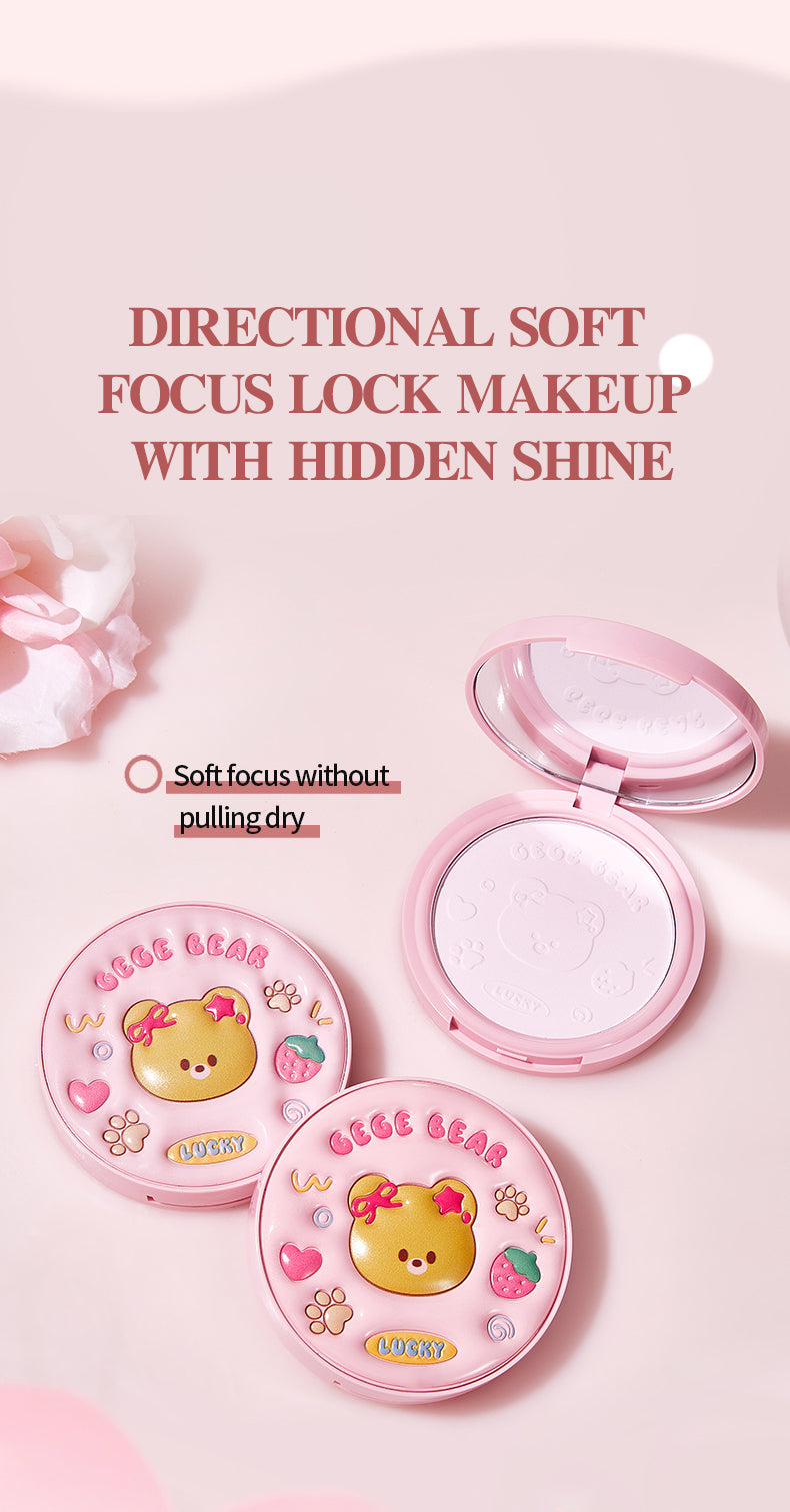 Two pink makeup compact cases with cartoon designs on a light pink background.