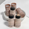 Makeup sticks with GEGE BEAR branding on a white background