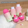 Pink blush with packaging held by a hand on a soft surface
