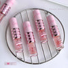 Set of pink nail polish bottles with checkered design on a round metal stand, brand 'Gege bear' visible.