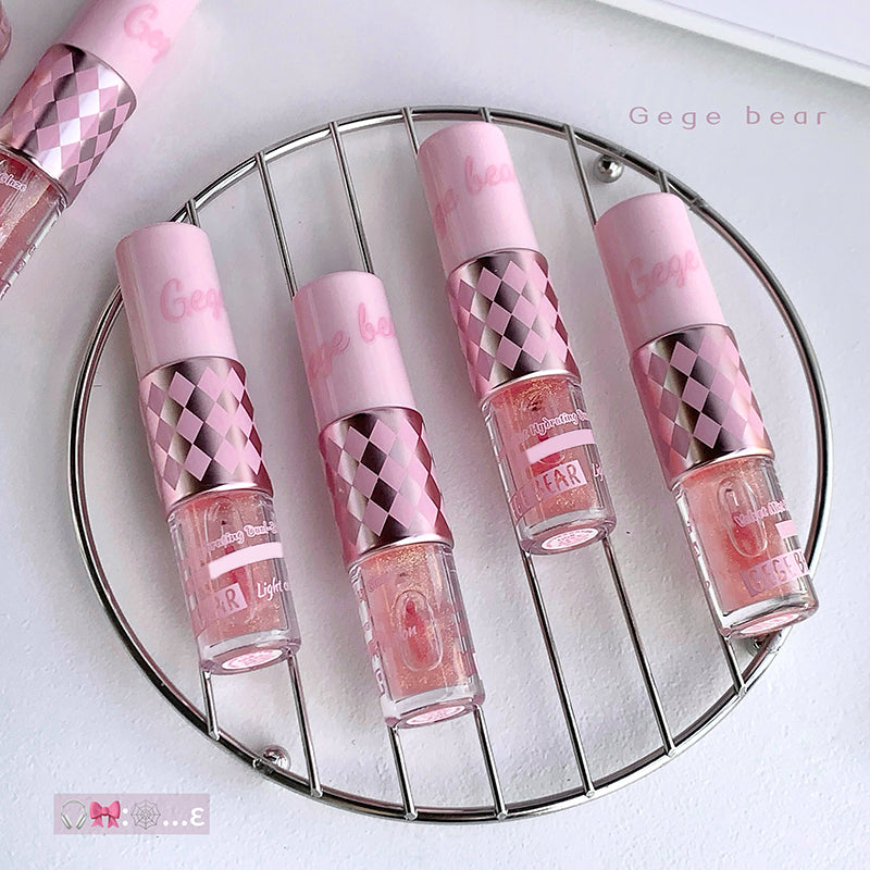 Set of pink nail polish bottles with checkered design on a round metal stand, brand 'Gege bear' visible.