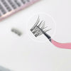 Close-up of false eyelashes with a magnifying tool on a blurred background