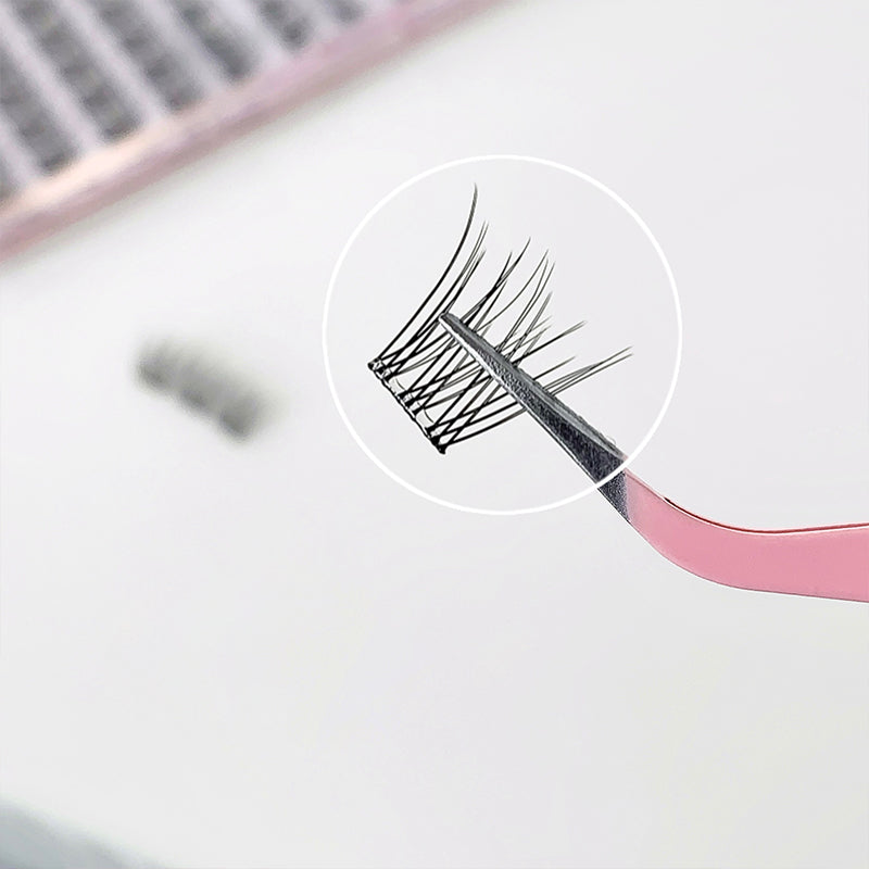 Close-up of false eyelashes with a magnifying tool on a blurred background