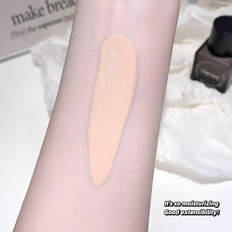 Product swatch on a person's arm with text about moisturizing and extensibility.