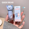 Cute bear-shaped product with packaging held by a hand, branded 'GEGE BEAR'.