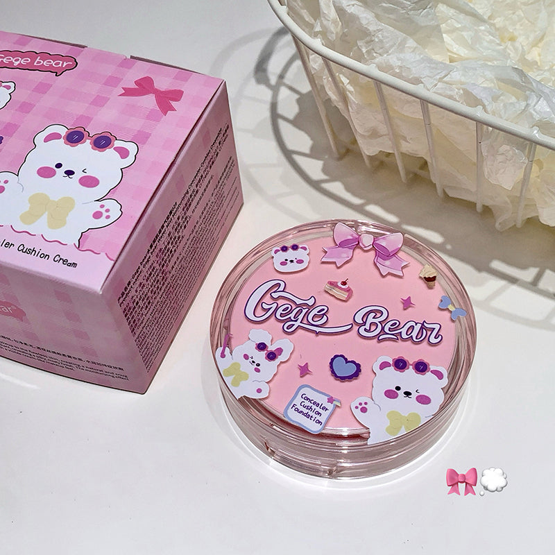 Pink cosmetic compact with 'Gee Bear' branding on a white surface