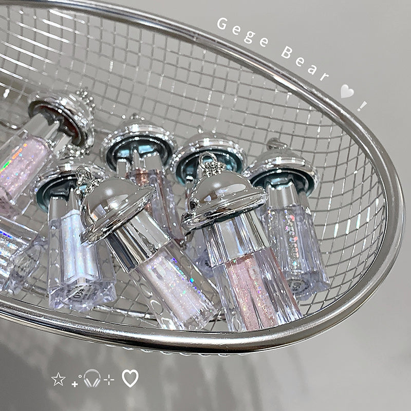 Close-up of a chandelier with crystal-like bottles on a tiled wall background