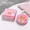Pink 'Gege Bear' cushion cream with packaging on a white surface