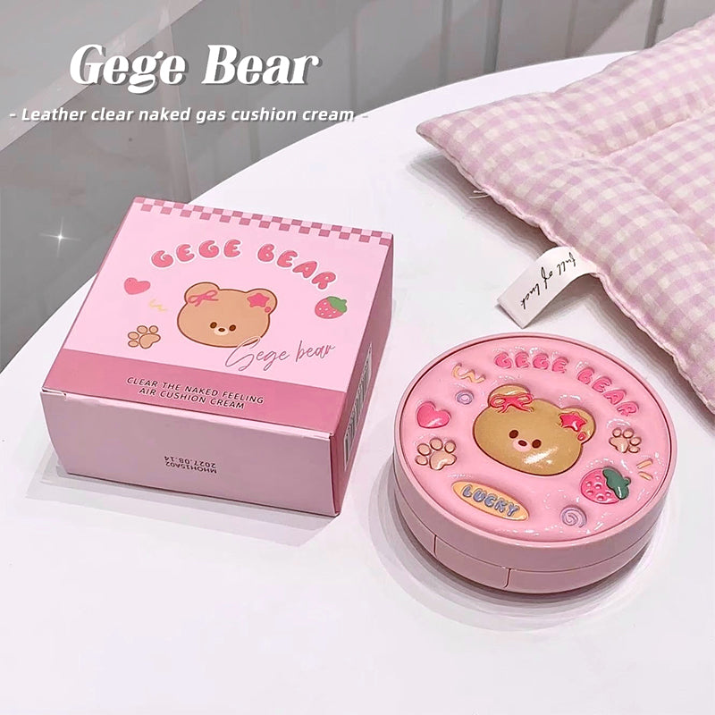 Pink 'Gege Bear' cushion cream with packaging on a white surface