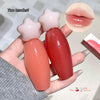 Two star-shaped lip balms held by a hand with a close-up of a glossy lip.