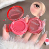 Two pink makeup products with 'GEGEBEAR' branding held by a hand against a neutral background.