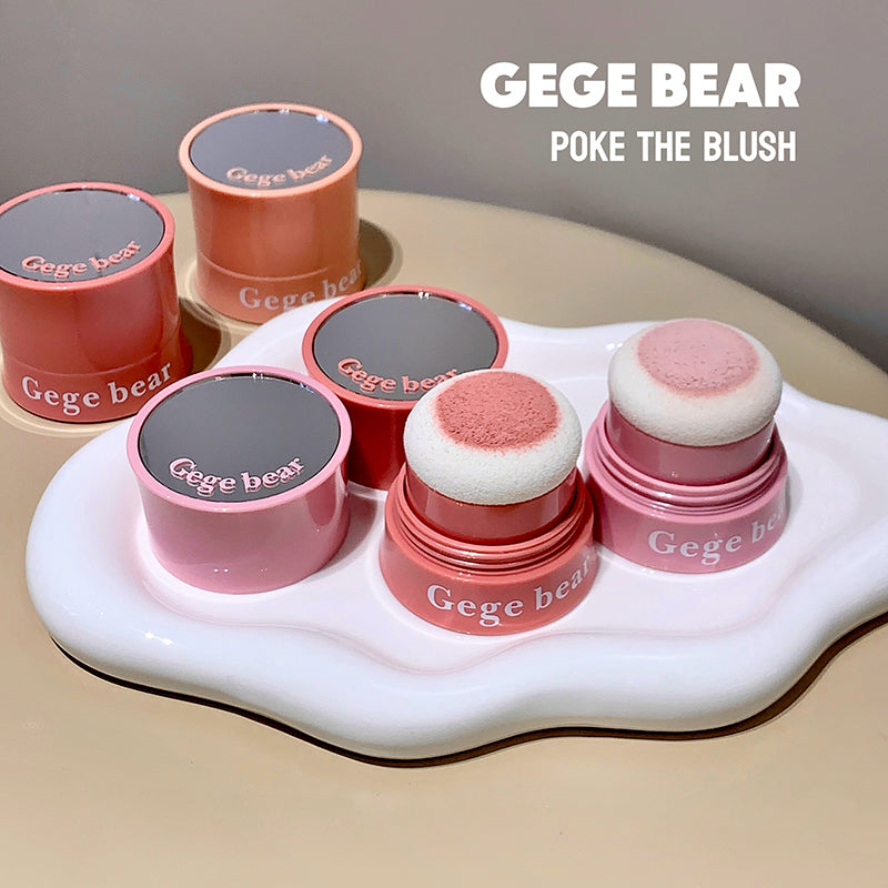 Gege Bear poke blushes on a white stand with a neutral background