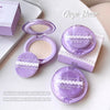 Purple makeup compact with open lid showing powder, surrounded by 'Gege Bear' packaging on a light background.