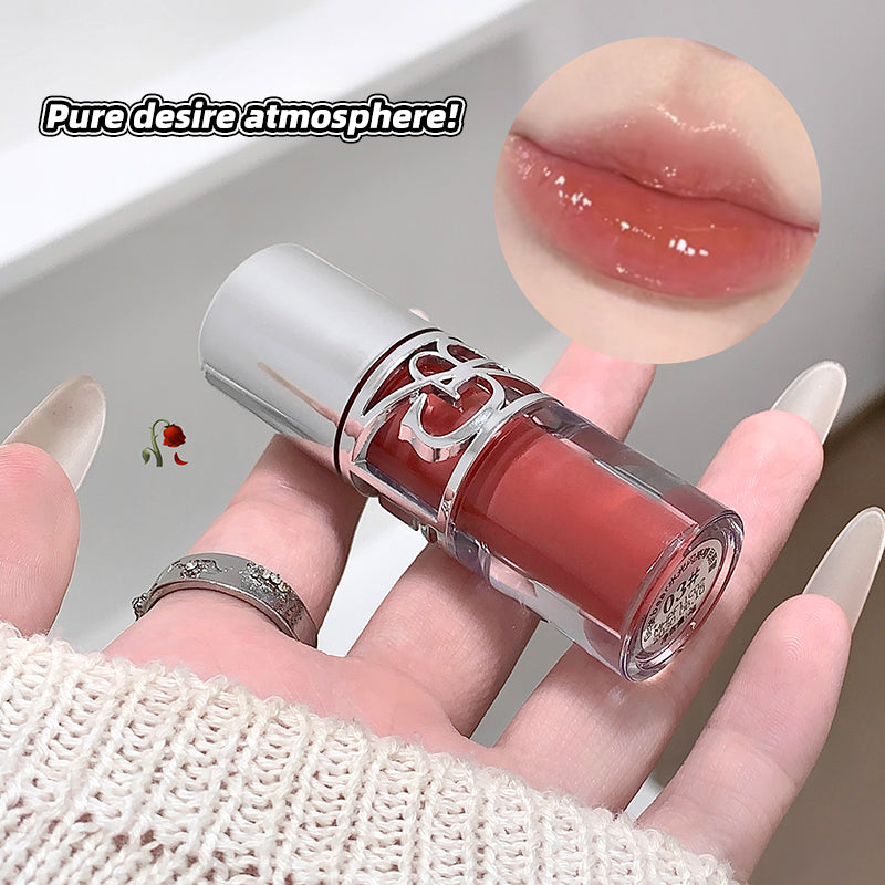 Lipstick held in a hand with close-up of lip color and text 'Pure desire atmosphere'.