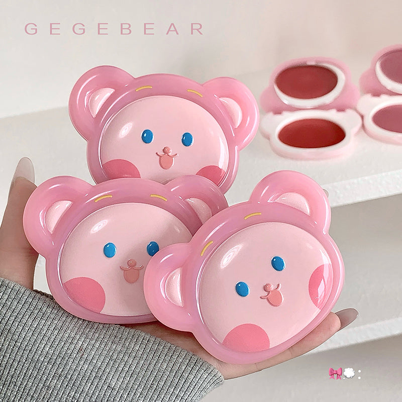 Pink bear-shaped containers held in a hand with 'GEGEBEAR' branding.