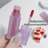 Lip tint with flocking brush head and close-up of application on skin