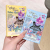 Two packages of glue-free false eyelashes held by a hand against a light background