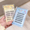 False eyelashes packaging with 'glue free' label held by a hand.