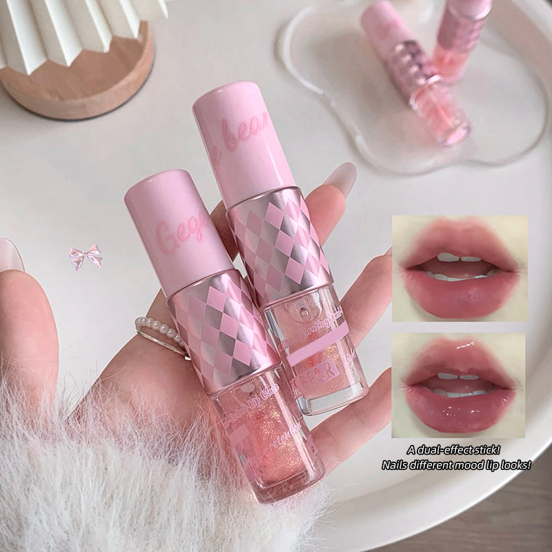 Pink dual-effect stick held by a hand with close-up of lip color and nail polish.