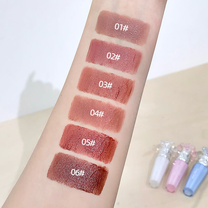 Lipstick swatches on a person's arm with color codes and lipsticks below.