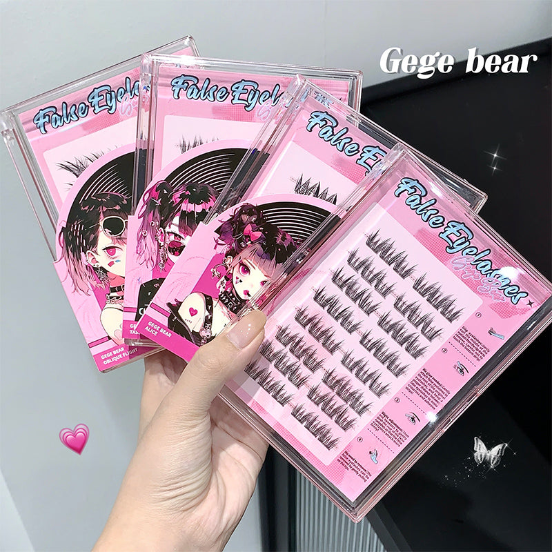 Set of false eyelashes packaging with pink and black design, held by a hand.