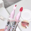 Two pink lip brushes with sponge heads in a clear case on a white background.