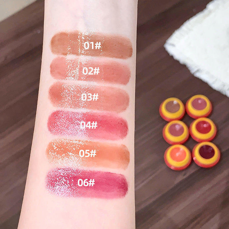 Collage of a lip balm with a bear design, applied to lips and swatched on skin.