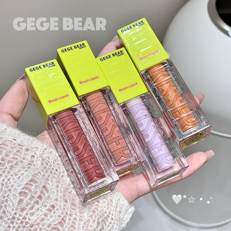 Hand holding three GEGE BEAR blush liquids with green packaging.