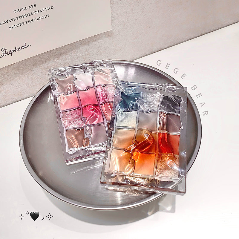 Two colorful gelatin dessert packages on a silver plate with 'GEGE BEAR' branding in the background.