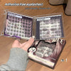 Set of false eyelashes in open boxes with a hand holding one box, on a wooden floor.