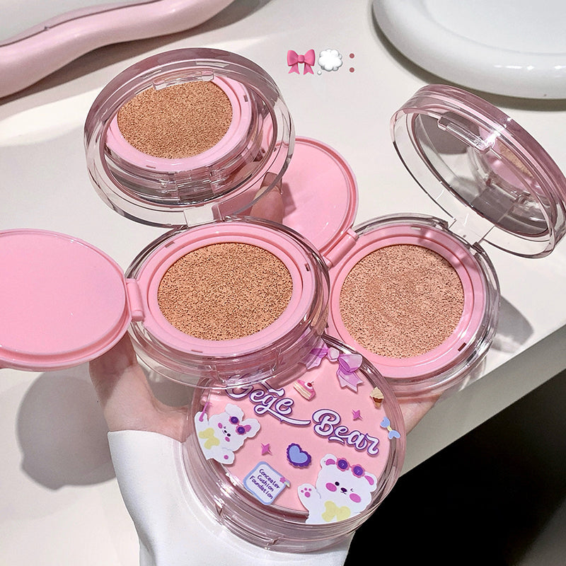 Compact powder with pink case and cartoon designs on a white background