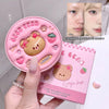 Pink cosmetic case with bear design and packaging on a white background